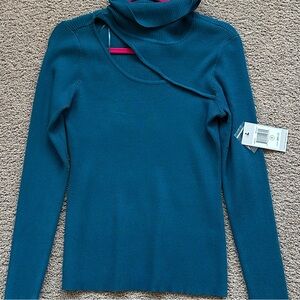 Blue turtle neck long sleeve top with cut out 
Brand: Cyrus 
Size: Medium
